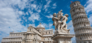 Angels Statue, Pisa Cathedral (Duomo di Pisa) (forefront), The Leaning Tower of Pisa (background), Piazza dei Miracoli ("Square of Miracles"). Pisa, Tuscany, Central Italy.