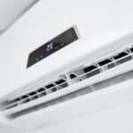 Split air conditioner on a white wall. Closeup image.