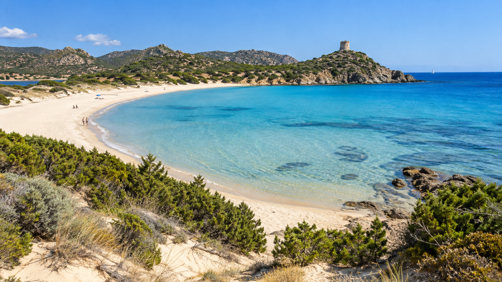 Chia beach with turquoise water, natural dunes and Torre di Chia in southern Sardinia